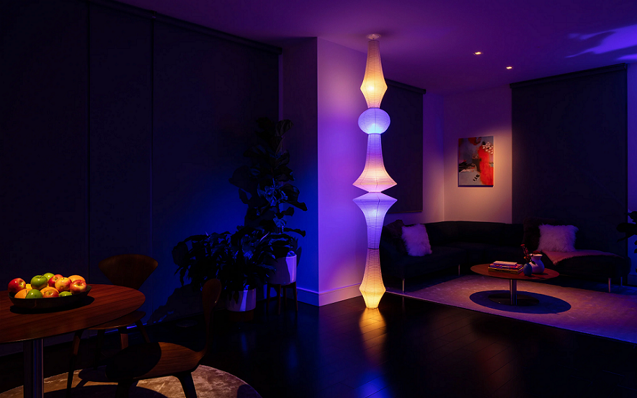 View of a living room and dining area illuminated by several Ketra lighting fixtures.