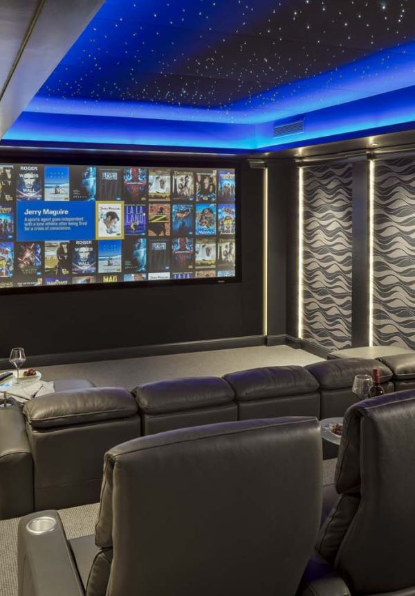 home theater with blue LEDs and kaleidescape screen